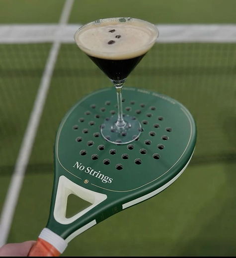 Two padel players at the net during a match